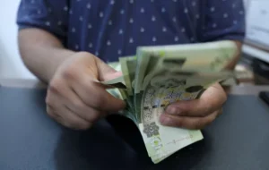 Libya devalues currency for first time in four years