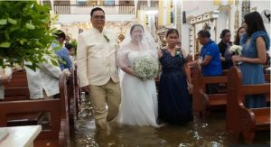 Why Filipino couples keep getting married in flooded churches