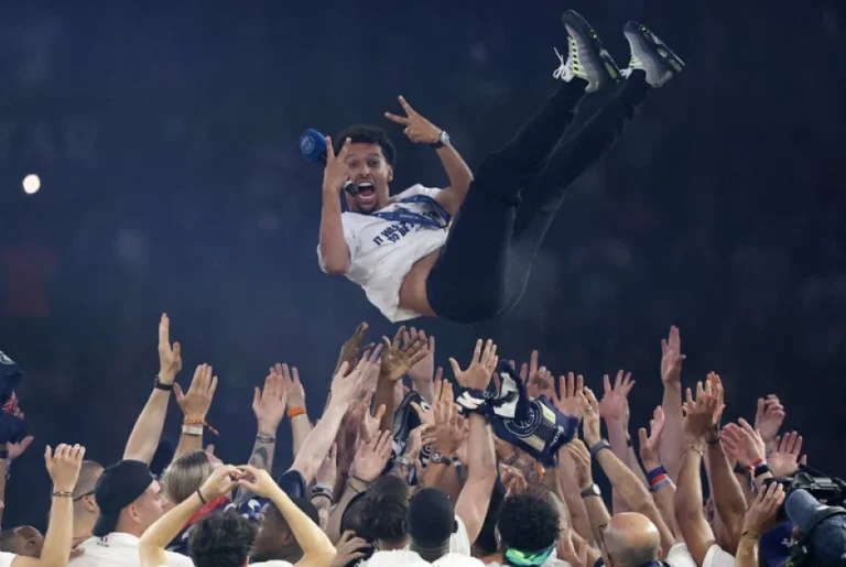 Paris celebrates football triumph amid riot recriminations